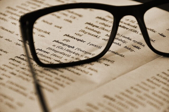 Photo of a dictionary in an article about CMMC glossary