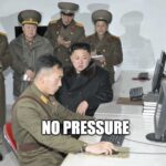 Funny meme showing a group of North Korea officers watch a stressed user perform a computer task. Similar to how a CMMC JSVA assessment goes!