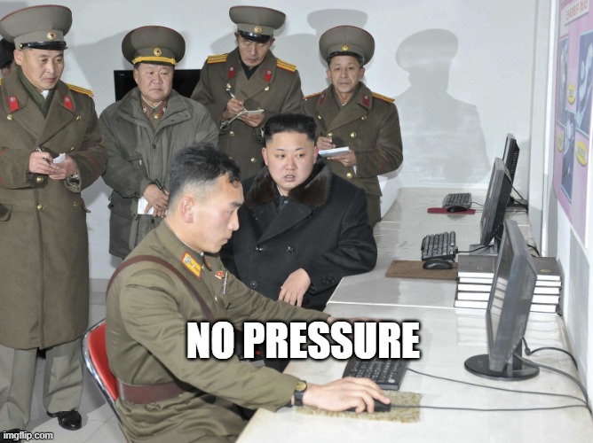 Funny meme showing a group of North Korea officers watch a stressed user perform a computer task. Similar to how a CMMC JSVA assessment goes!